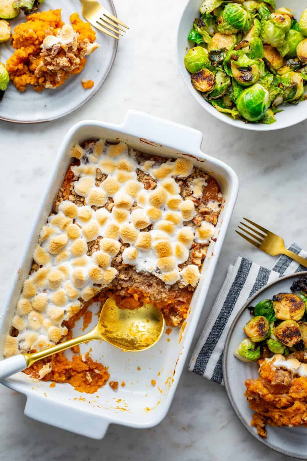 Sweet potato casserole with streusel topping in a white casserole dish