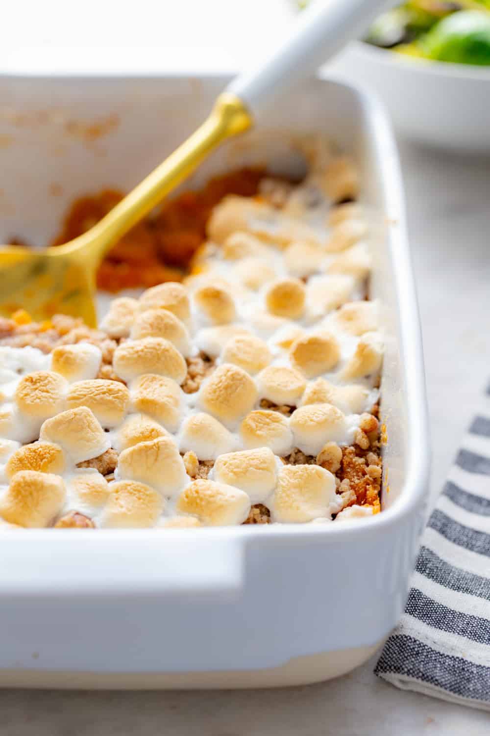 Close-up view of marshmallows and streusel topping on sweet potato casserole