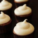 Close up of pumpkin spice cupcakes with a black background