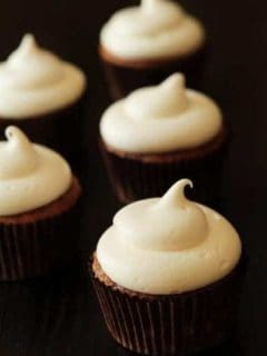 Close up of pumpkin spice cupcakes with a black background