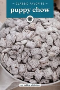 Close up of puppy chow in a large white bowl. Text overlay includes recipe name.