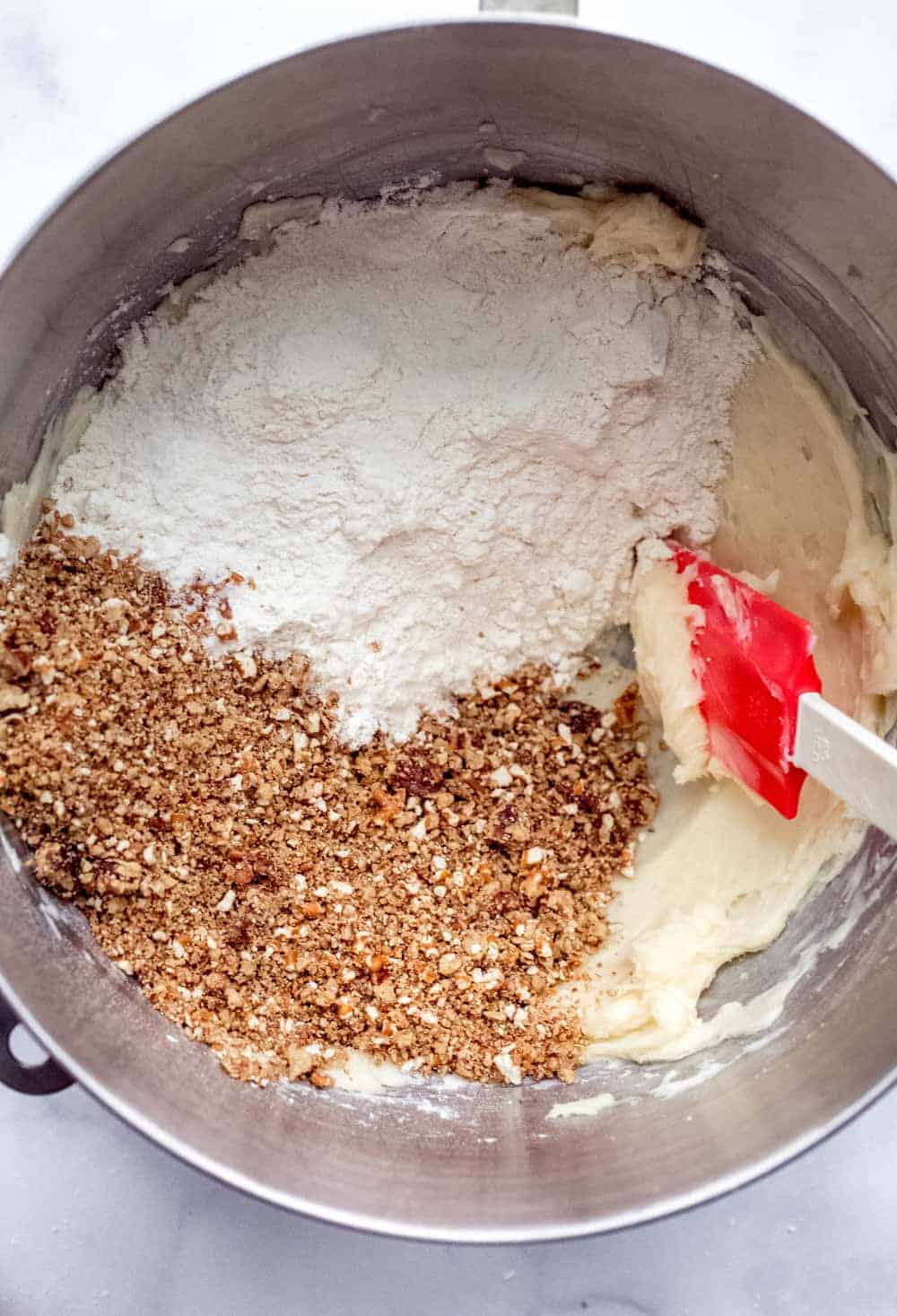 Snowball Cookie dough ingredients in the bowl of a stand mixer