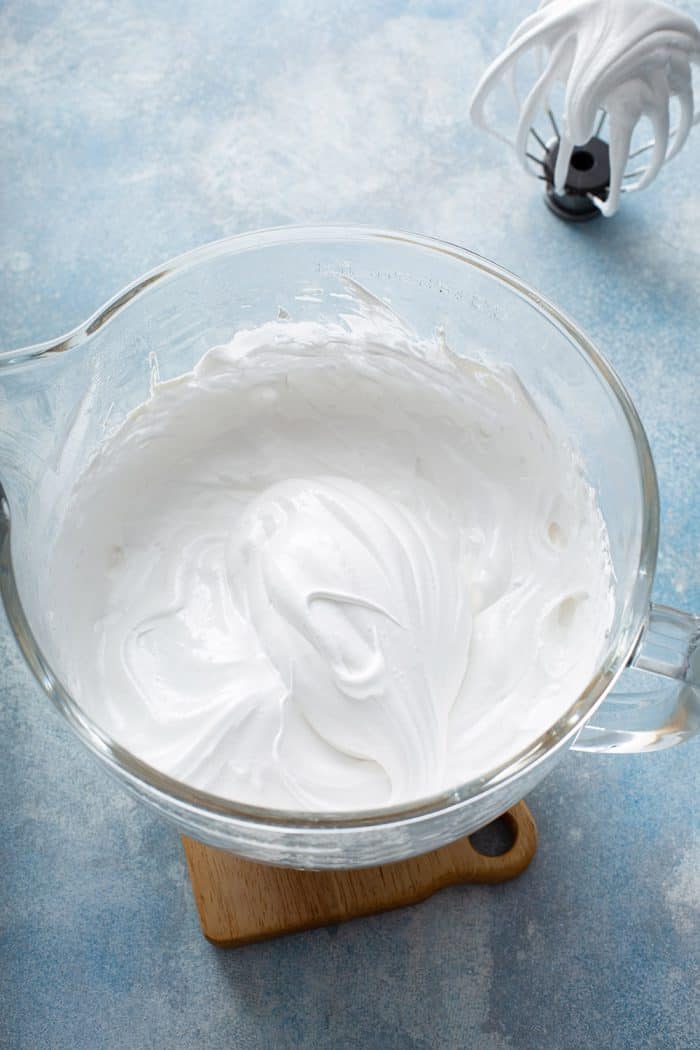 Whipped homemade marshmallow in a glass mixing bowl