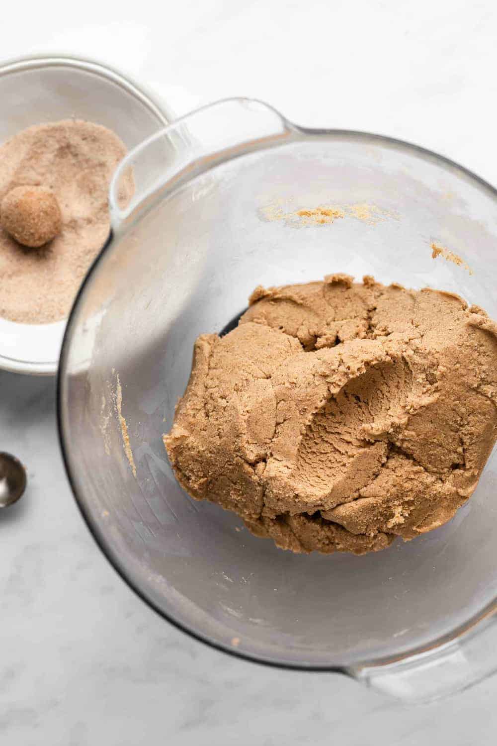 Chai sugar cookie dough in a glass mixing bowl