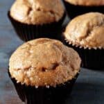 Chai muffins on a wood surface