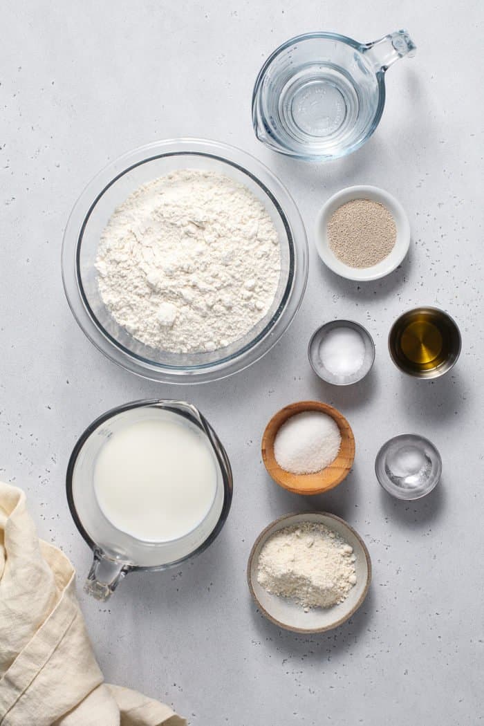 English muffin bread ingredients arranged on a light countertop