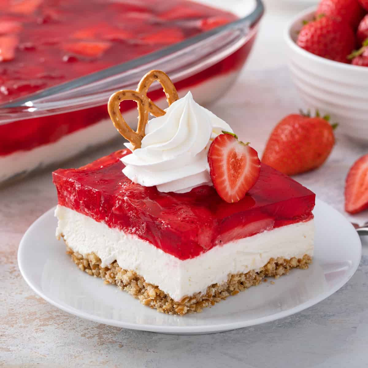 https://www.mybakingaddiction.com/wp-content/uploads/2012/03/plated-slice-strawberry-pretzel-salad-hero.jpg