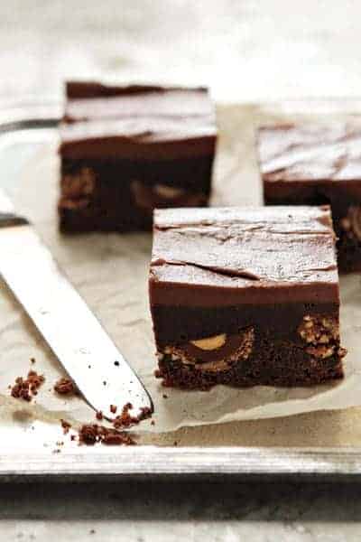 Nutella brownies cut, next to a knife on a baking sheet