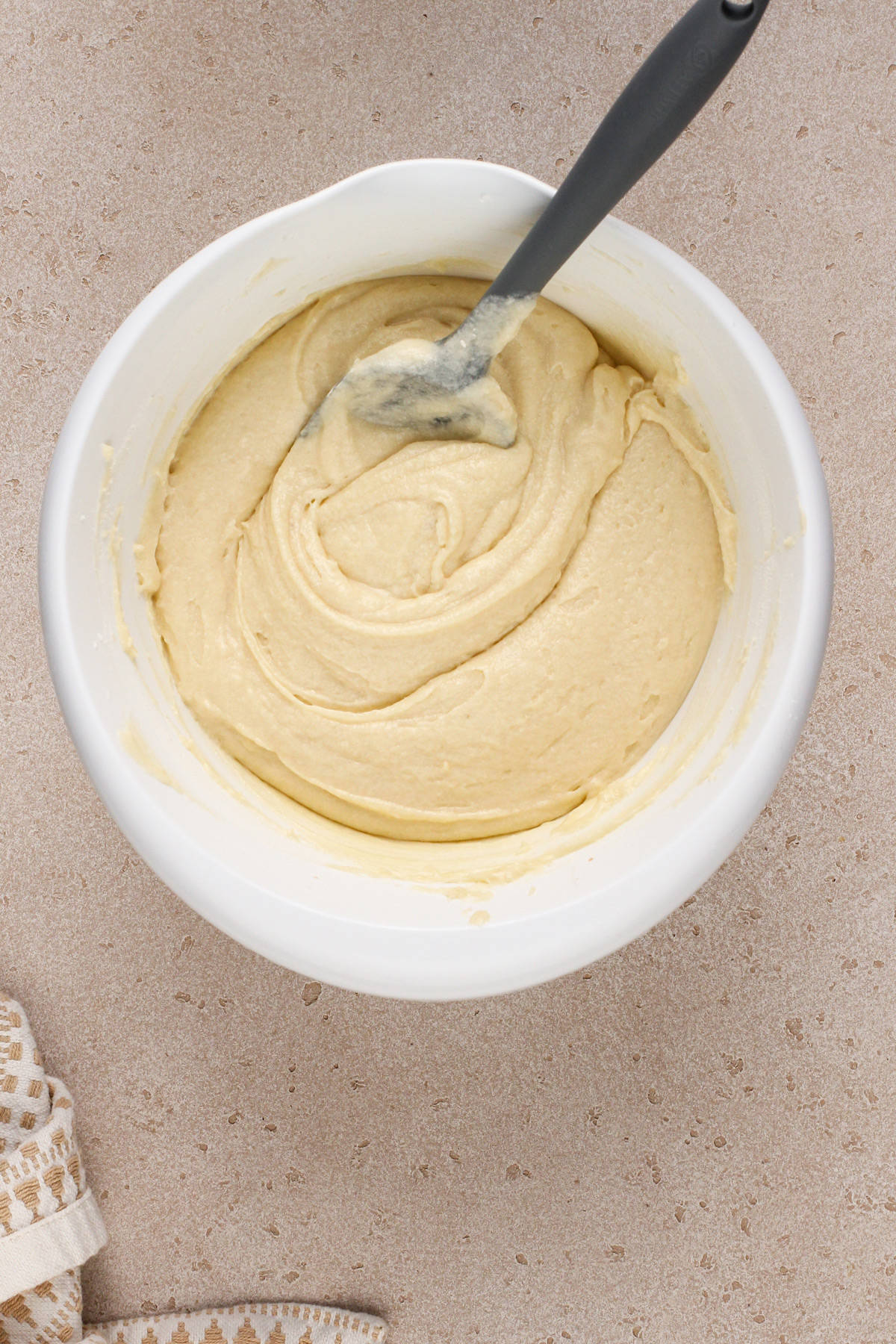 Banana bundt cake batter base in a white bowl.