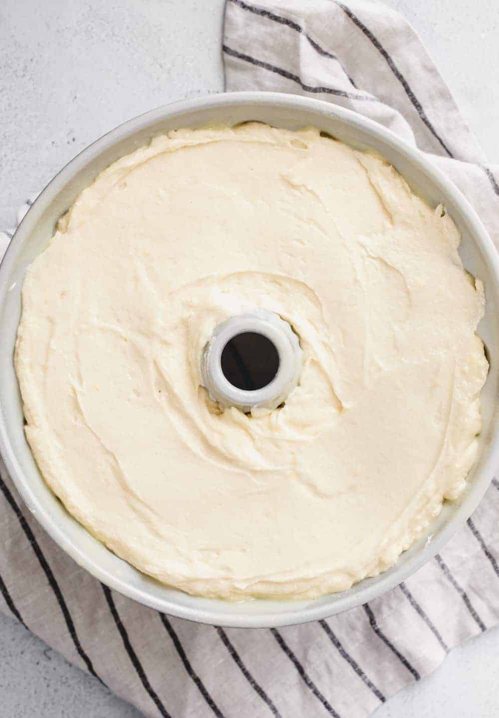 Batter for 7up pound cake in a bundt cake pan, ready to be baked