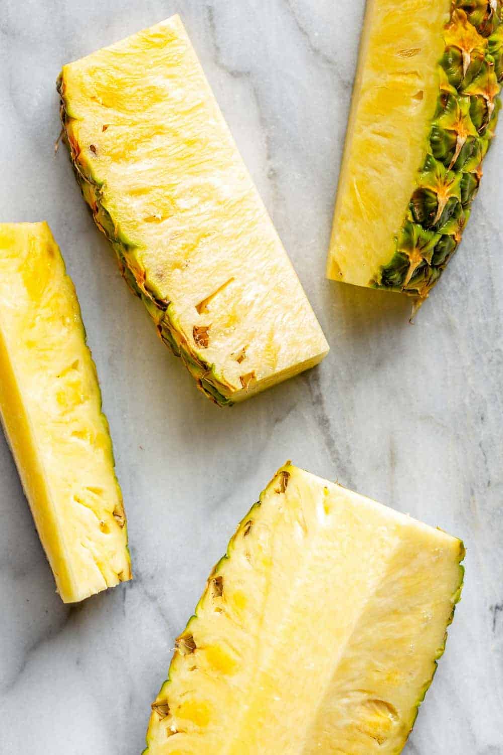 Slices of pineapple on a marble surface