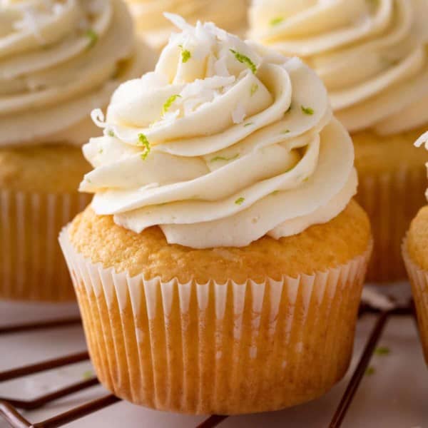 Close up of frosted coconut cupcake.