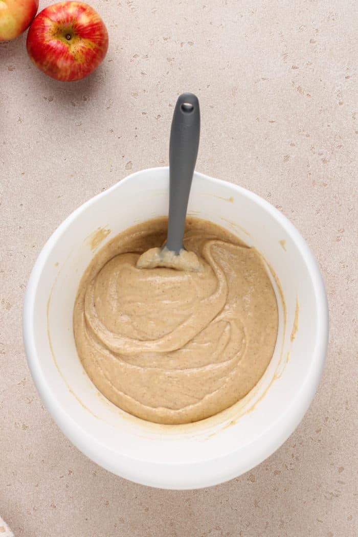 Batter base for apple cider donut muffins in a white bowl.