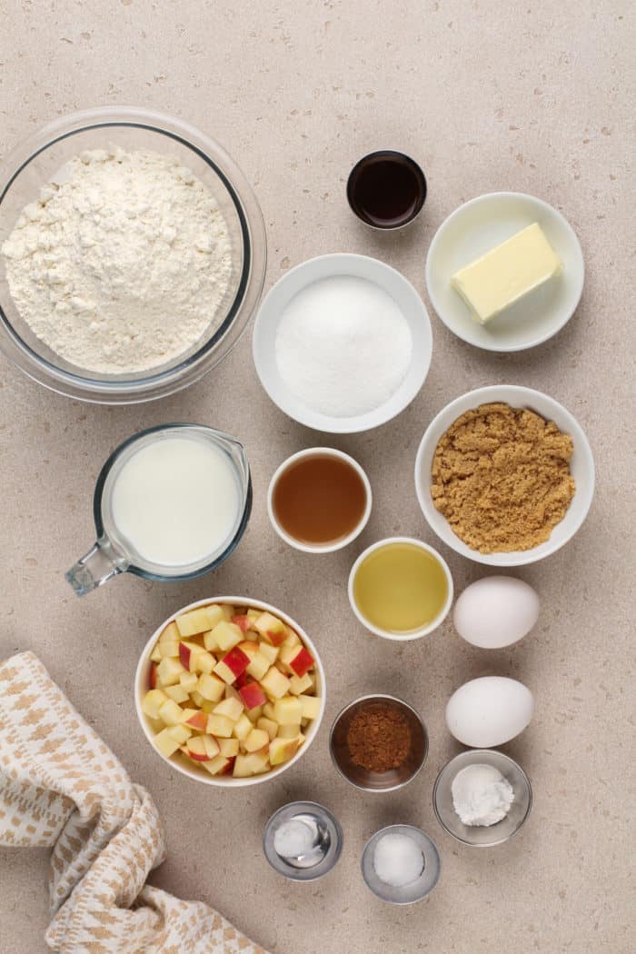 Ingredients for apple cider donut muffins arranged on a countertop.