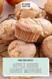 Glazed apple cider donut muffins arranged on a wire rack. Text overlay includes recipe name.