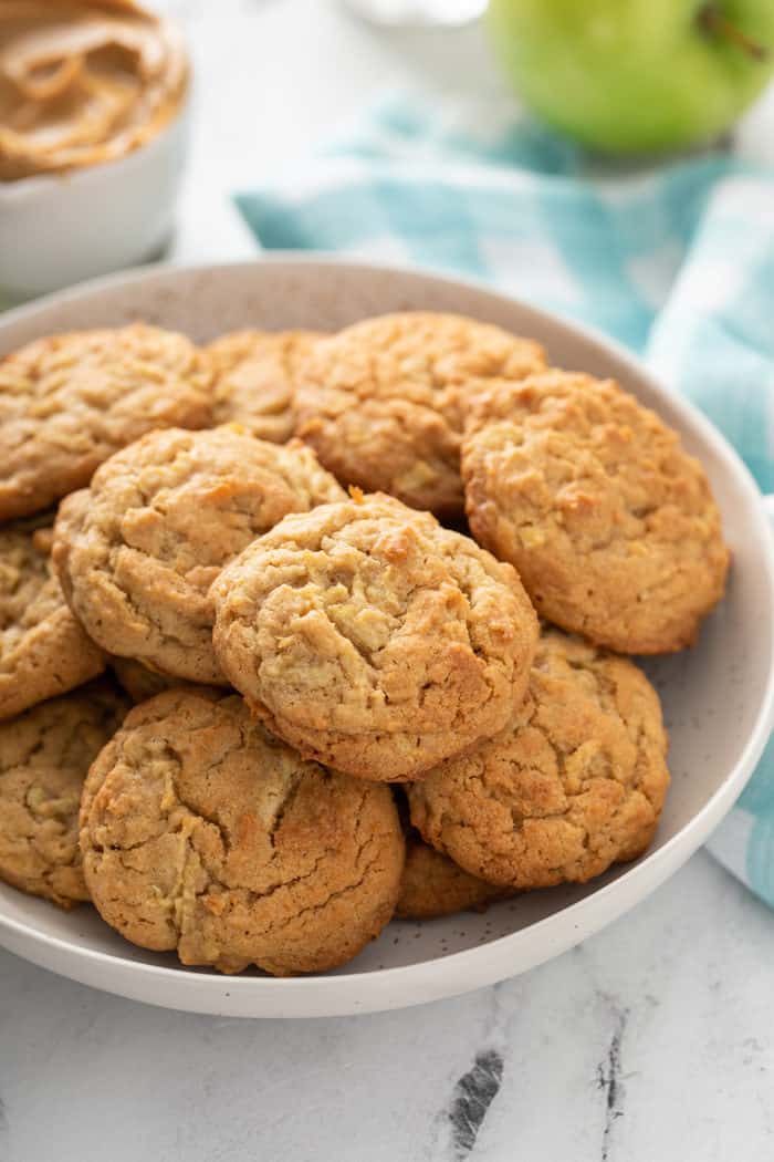 White plate filled with apple peanut butter cookies