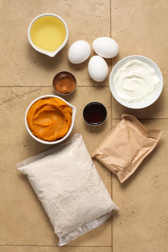 Pumpkin spice cupcake ingredients arranged on a countertop