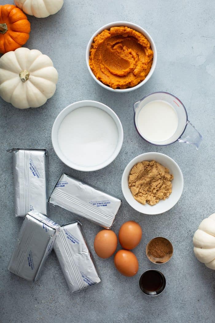 Ingredients for pumpkin cheesecake filling on a countertop