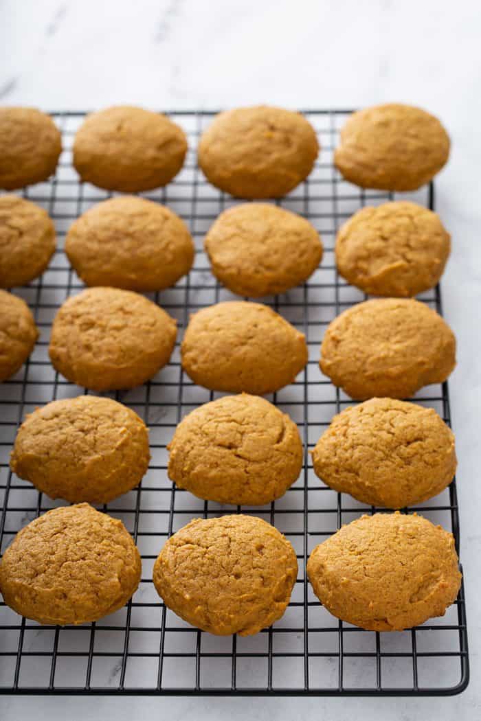 Pumpkin cookies cooling on a wire rack