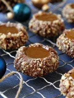 Caramel thumbprint cookies on a cooling rack