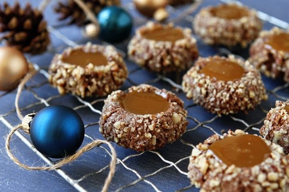 Caramel thumbprint cookies on a cooling rack