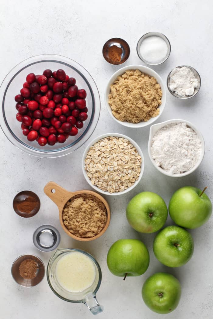 Cranberry apple crisp ingredients arranged on a countertop.