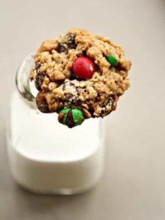 Monster cookie resting on top of a glass of milk