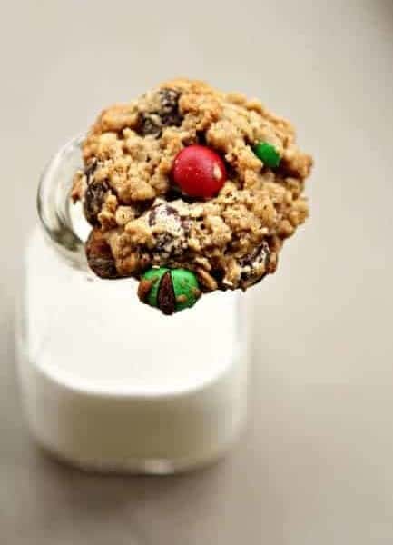 Monster cookie resting on top of a glass of milk