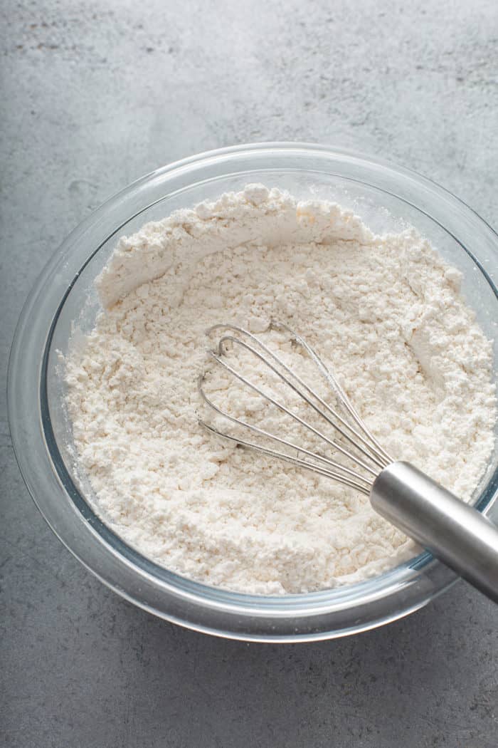 Dry ingredients for blondies whisked in a glass mixing bowl