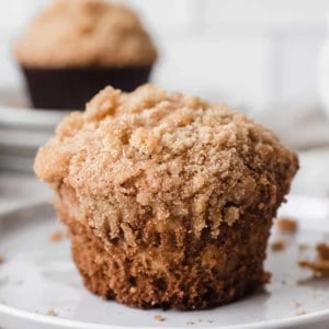 Close up of banana crumb muffin on a white plate