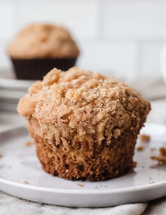 Close up of banana crumb muffin on a white plate