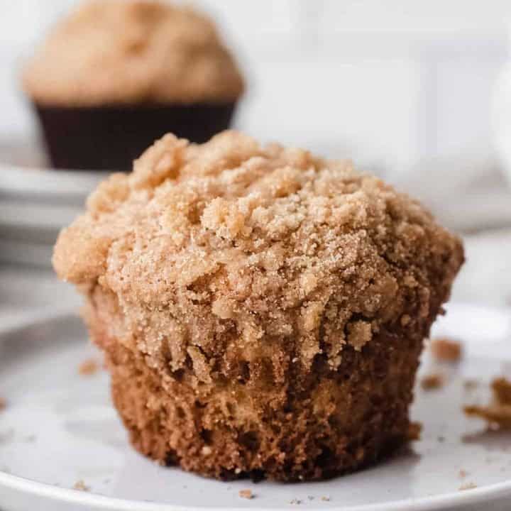 Close up of banana crumb muffin on a white plate