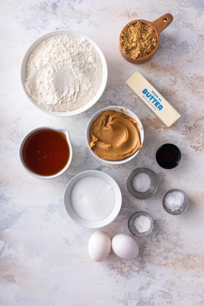 Honey peanut butter cookie ingredients arranged on a countertop.