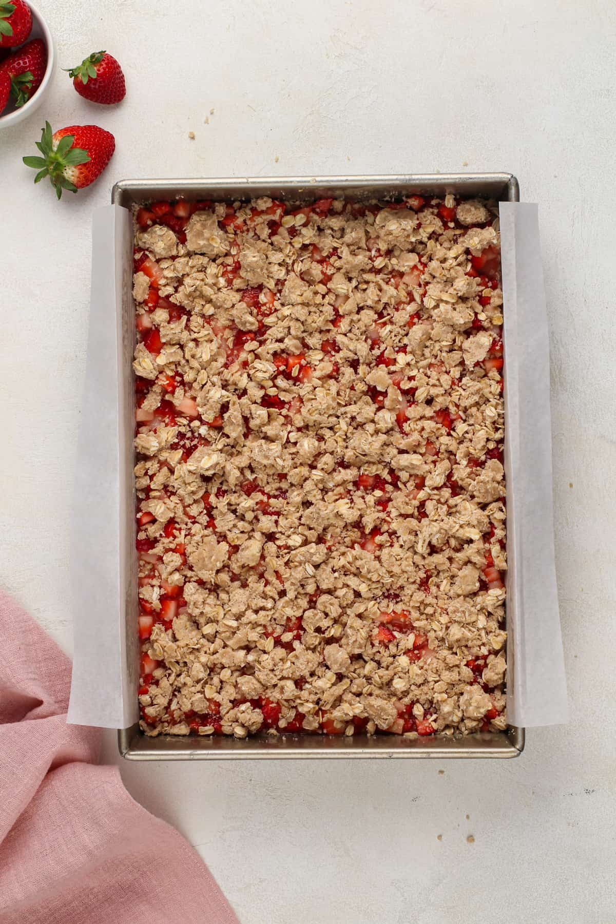 Assembled strawberry oat bars ready to go in the oven.