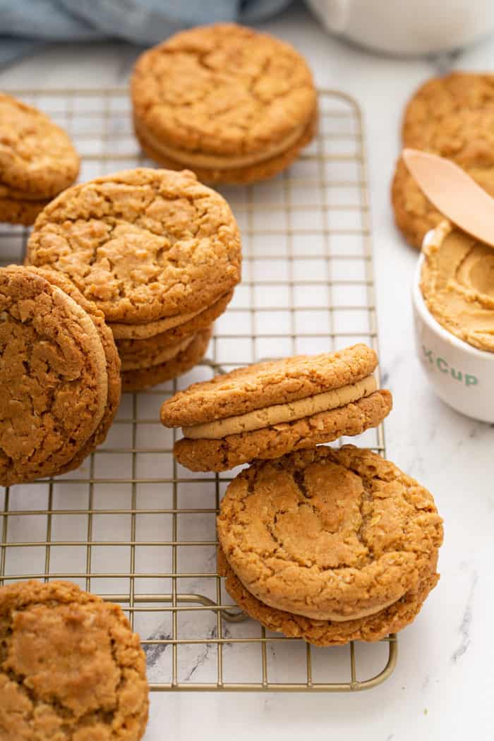 Biscoff sandwich cookies scattered in a wire cooling rack