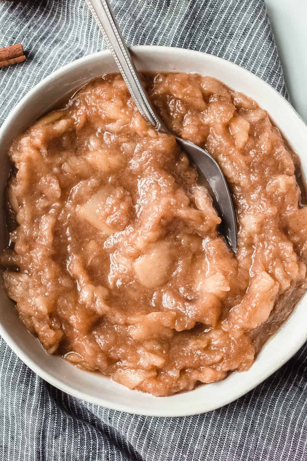 Overhead view of crockpot applesauce, showing chunky texture