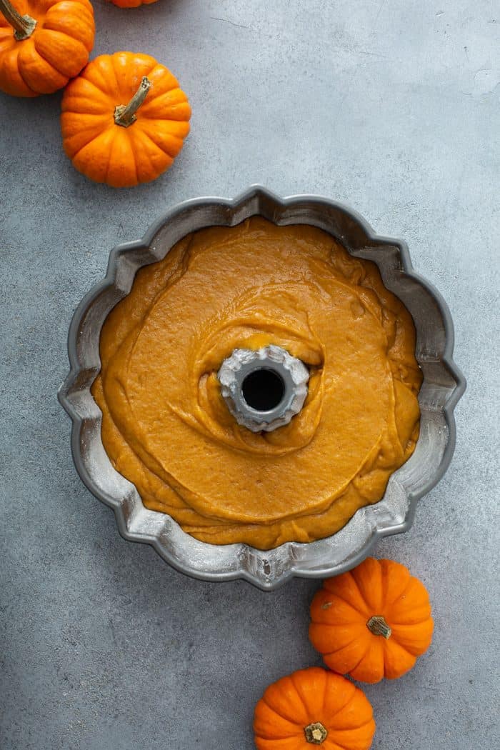 Batter for pumpkin bundt cake in a bundt pan, ready to be baked