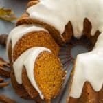 Sliced pumpkin bundt cake on a wire rack