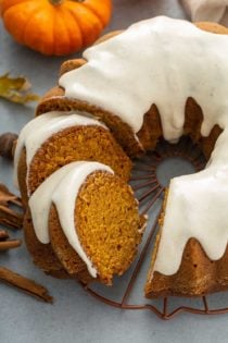 Sliced pumpkin bundt cake on a wire rack