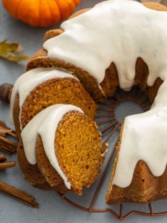 Sliced pumpkin bundt cake on a wire rack