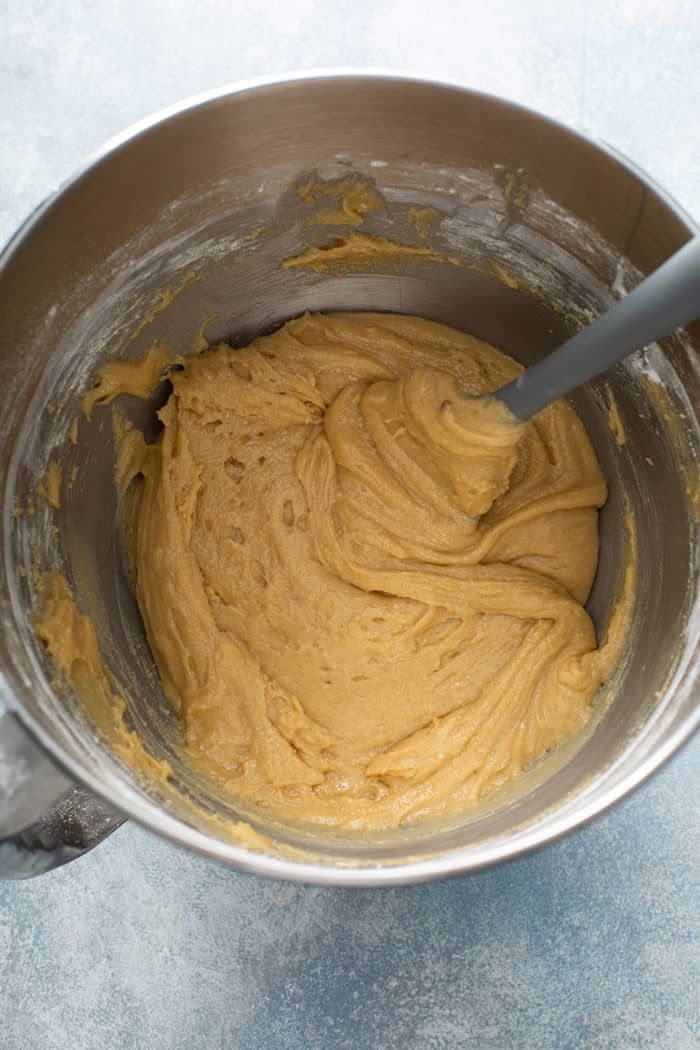 Batter base for salted caramel blondies in a metal mixing bowl