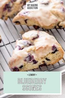 Glazed blueberry scones set on a wire cooling rack over a sheet pan. Text overlay includes recipe name.