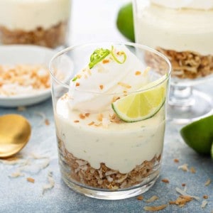 Close up of individual key lime cheesecakes with graham cracker crumble