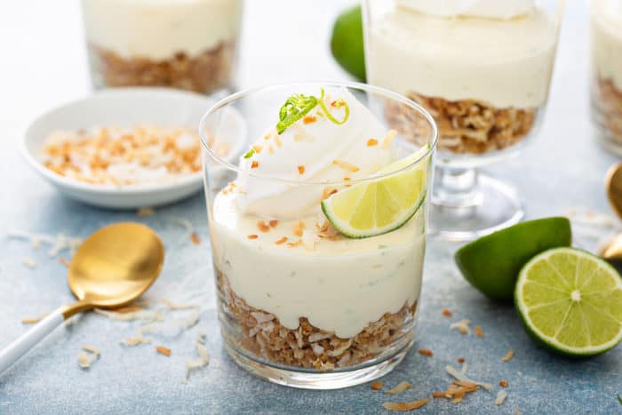 Close up of individual key lime cheesecakes with graham cracker crumble