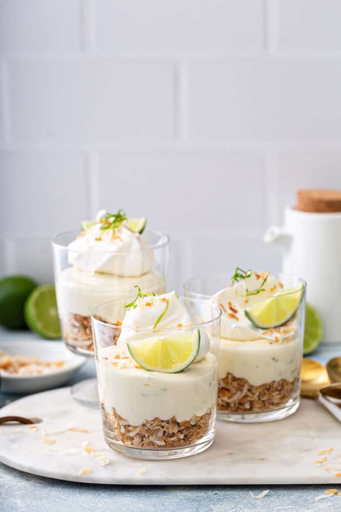 Assembled key lime cheesecakes on a marble board
