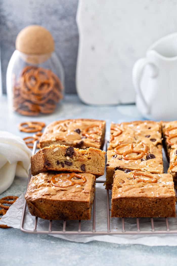 Sliced salted caramel blondies cooling on a wire rack