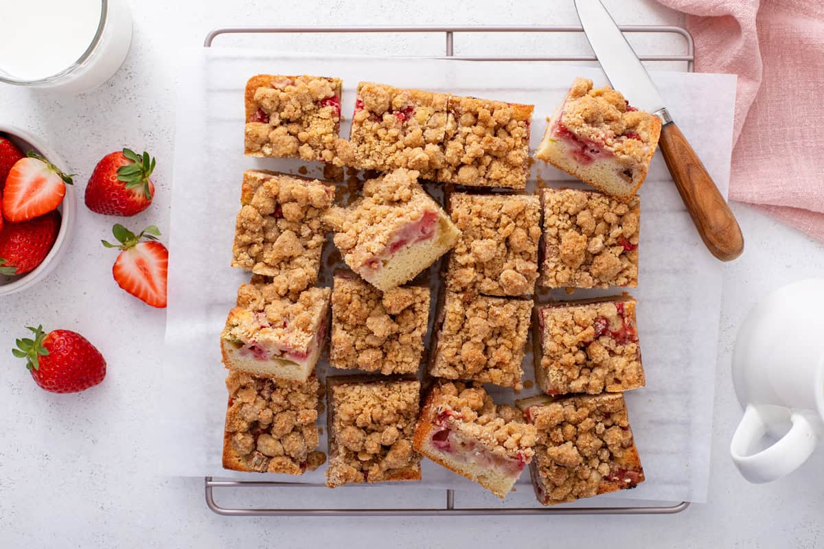 Strawberry rhubarb cake cut into squares.