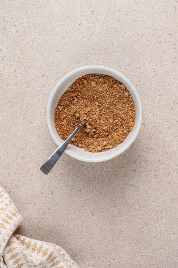 Bowl of brown sugar and pumpkin pie spice mixed together.
