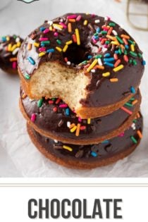 Three chocolate glazed donuts stacked on a piece of parchment paper. The top donut has a bite taken out of it. Text overlay includes recipe name.
