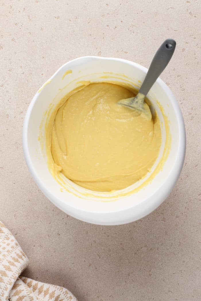 Cake mix for honey bun cake in a white mixing bowl.